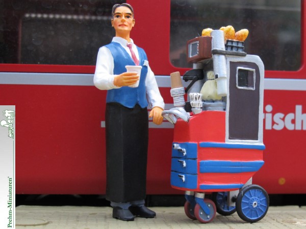  Art.-Nr. 550109 Barwagen im Zug mit Bedienung. Hier bekommt der Reisende Kaffee, Tee oder Getränke serviert. Auch Hörnchen und weitere Leckereien können angeboten werden. Kunststofffigur hat große CapuccinoTasse in der Hand.  Kunststoff, handbemalt